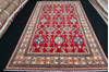 Kazak Red Hand Knotted 67 X 100  Area Rug 700-111900 Thumb 1
